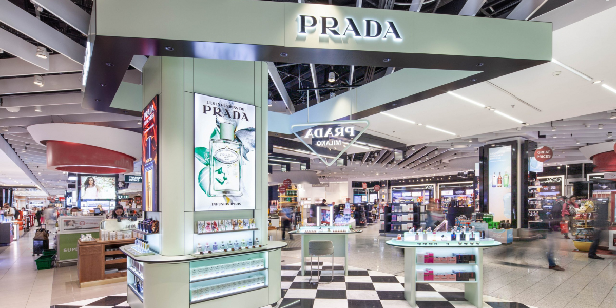 the Croisette in a Prada Outlet white robe dress with